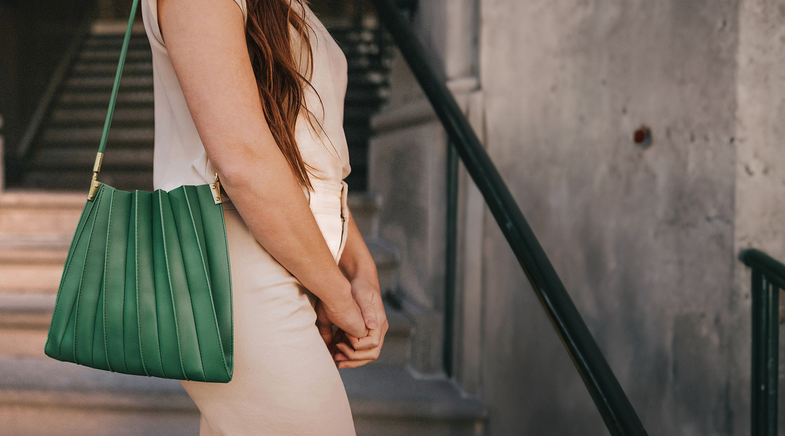 Lady carrying green handbag